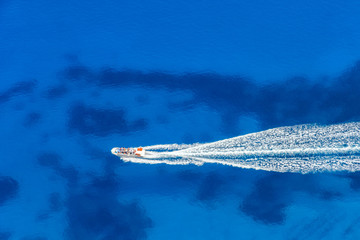 Aerial view of speed boat in azure sea