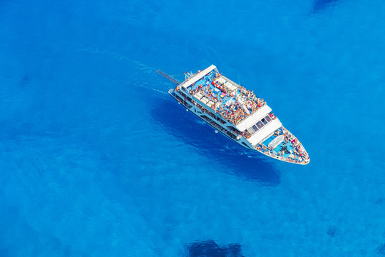 Aerial view of cruise boat in azure sea