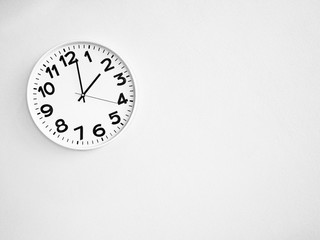 Monochrome clock on the wall for background