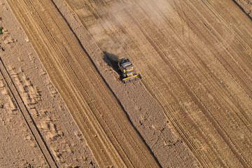 aerial view of the combine on harvest field