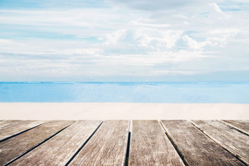 Fototapeta na wymiar Wooden terrace with the beach view in summer