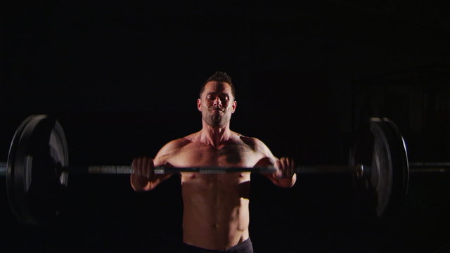 Weight lifter training at gym