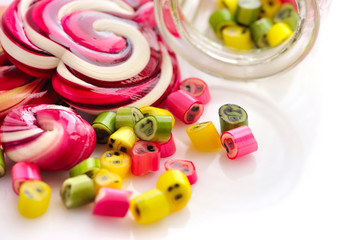 Colorful candies and lollipops on a white background