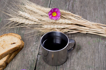 three croutons, cup of coffee and linking of wheat