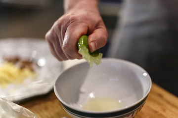 hands that squeeze a lime