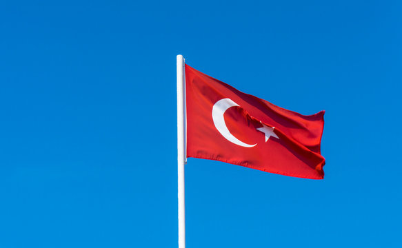 flag of Turkey on blue sky