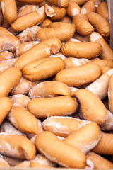 many sausages in natural casing as a background