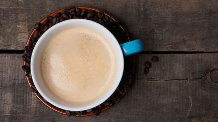 Cup of coffee on wood