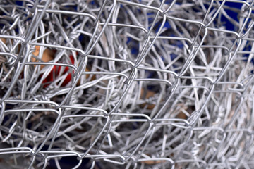 barbed wire fence in wire mesh fence