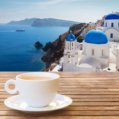 Fototapeta na wymiar Cup of coffee on Santorini 