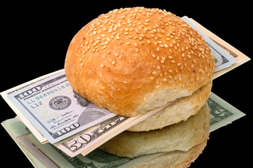 Sandwich with a pack of dollars on black