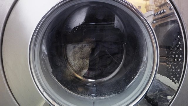 Clothes in Washing Machine Cleaning. laundry machine, clothes washer, or washer is a machine used to wash laundry, such as clothing and sheets.