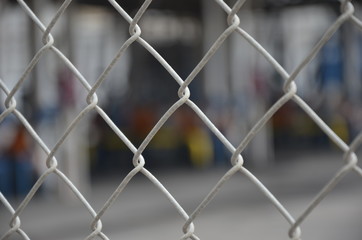 Fototapeta premium Chain link fence blurred background