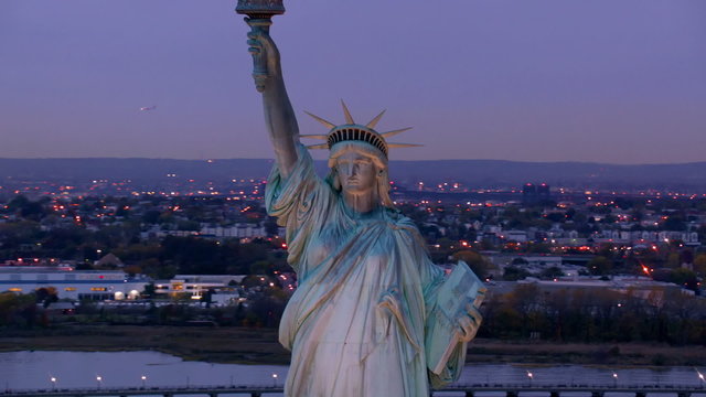 Statue of Liberty at dusk, aerial shot