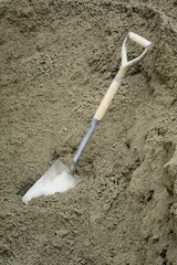 Shovel in sand on a construction site