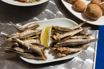 Boquerones fritos and papas arrugadas - Spanish fried anchovies. Delicious tapas typical of Canary Island

