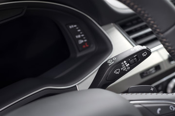 Fototapeta na wymiar Wipers control. Modern car interior detail.