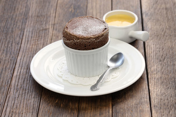 freshly baked chocolate souffle with creme anglaise, french dessert