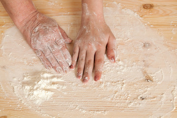 Fototapeta premium hands of the grandmother and hand of the granddaughter lie