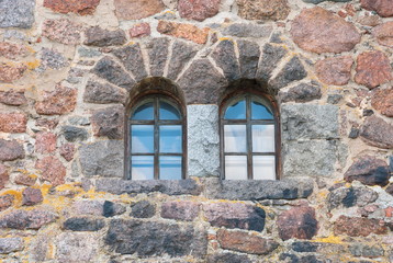 Windows on an old brick fortress wall
