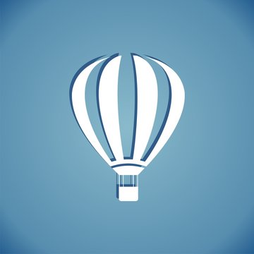 Hot air balloon icon embossed on blue background