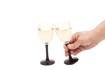 Hand holds glass goblet with champagne isolated on white backgro