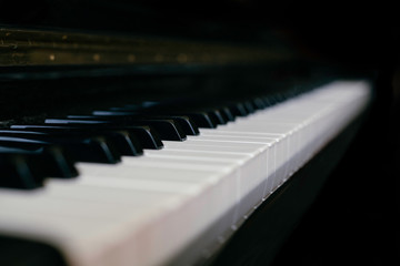 Close-up monochrome shot of piano keyboard, small depth of field, black and white. © Andphotography