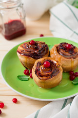 Homemade rolls with cranberry, cinnamon and citrus glaze