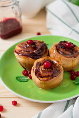 Homemade rolls with cranberry, cinnamon and citrus glaze