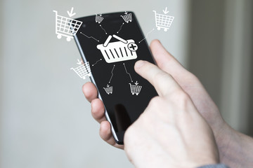 Businessman pressing button shopping cart icon online phone