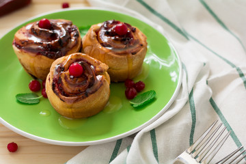 Homemade rolls with cranberry, cinnamon and citrus glaze