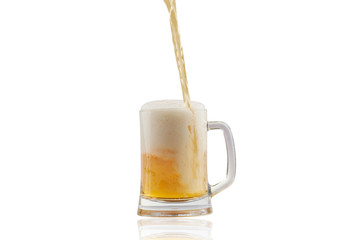 Beer pouring into glass isolated over white background