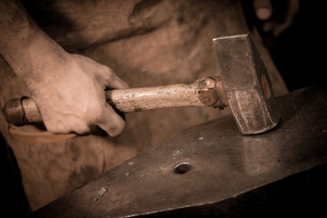 Blacksmith holding a hammer