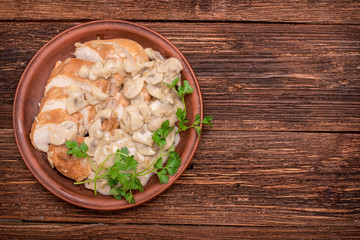 Chicken breast in creamy mushroom sauce. Background.