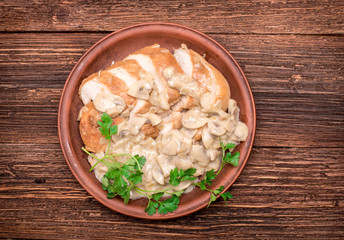 Chicken breast in creamy mushroom sauce.