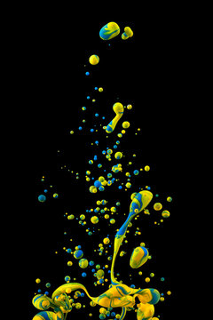Photograph of an ink drop forming color bubbles underwater. Liquids mixing in dynamic flow forming round shapes with vivid structure. A detailed colorful abstract design isolated on black background.
