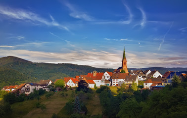 Fototapeta na wymiar .Sunset over the German village Bermersbach in the mountains of the Black Forest .Germany