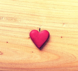 red heart on old shabby wooden background