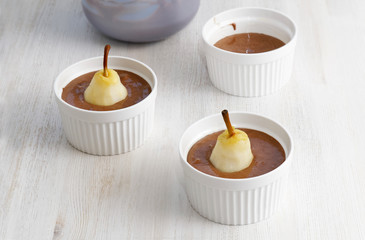 Peeled pears omitted in raw dough and ready for baking