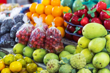 Naklejka na ściany i meble Street market with different exotic fruits. Asia