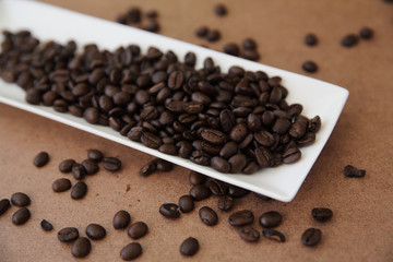 Coffee beans isolated in wood background