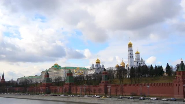 4k Red brick walls of famous Kremlin and Ivan Great Bell Tower in Moscow, Russia. Sunny day. Time Lapse