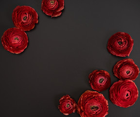 red elegant flowers at black table