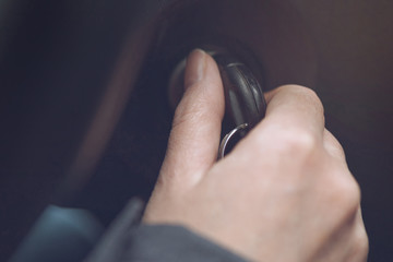 Woman with car keys, female driver starting vehicle engine