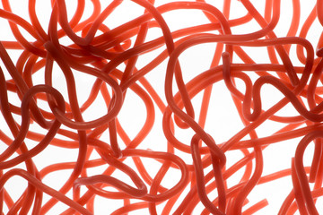 Red chewy strawberry laces as a background image