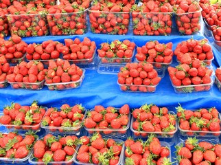 Strawberries ripe spring in containers in the market
