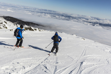 Freestyle skiing in the mountain cloudy sky