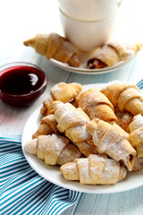 Fresh homemade croissants on a blue wooden table