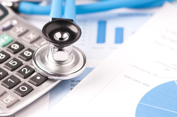 Stethoscope and financial papers 