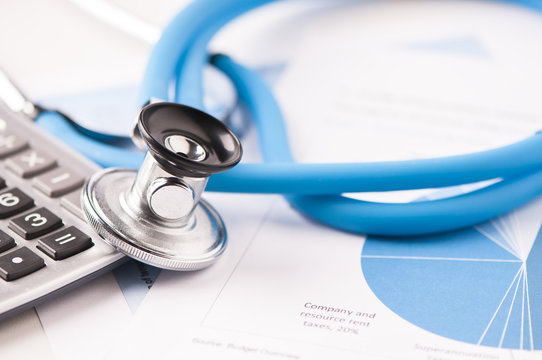 Stethoscope and financial papers 